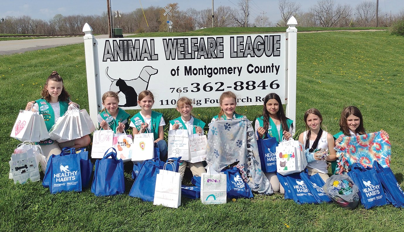 Local Girl Scout Troop 4383 of Montgomery County delivers tie blankets, toys and more Saturday to the Animal Welfare League. The project earned the troop to coveted Bronze Award, sought by more than half a million Scouts each year. Members visiting AWL Saturday included Keliegh Anderson, from left, Abriella Purple, Anna Bowers, Brooklyn Wilkins, Elliot Hamilton, Jillian Clarn, Journey Hinchman and Bella Hutson.